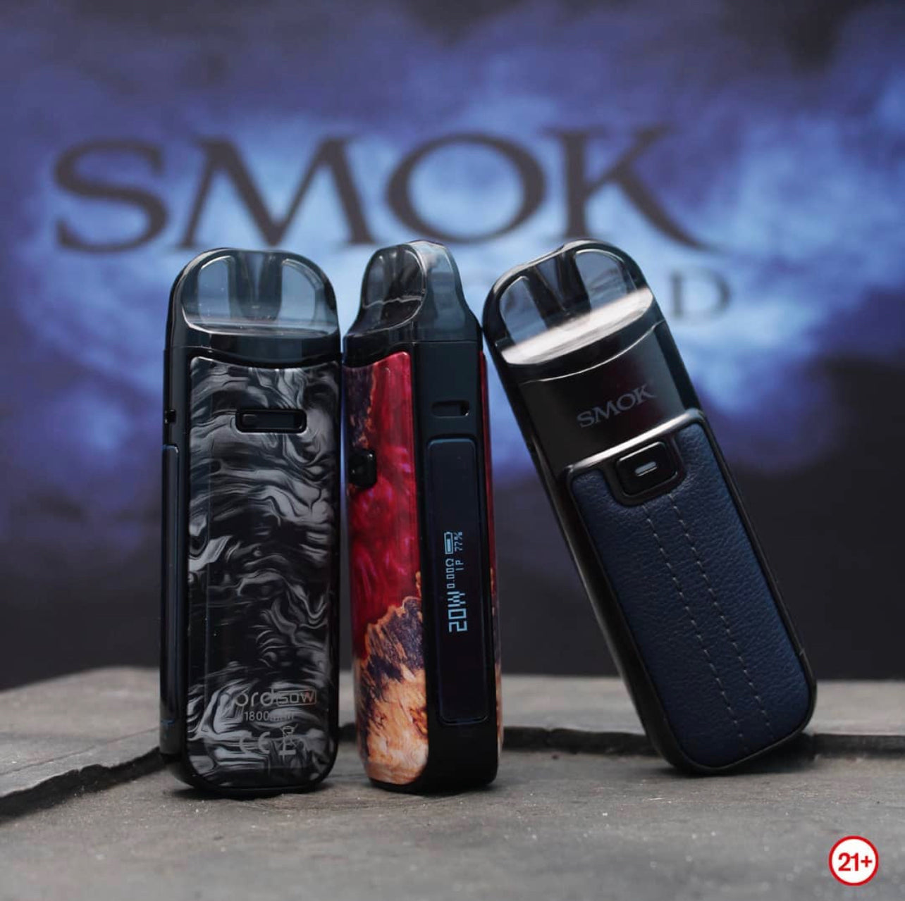 Three SMOK NORD 50W Pod Kits in black marble, red resin, and navy leather designs, featuring 1800mAh battery and LP2/nord coil compatibility.