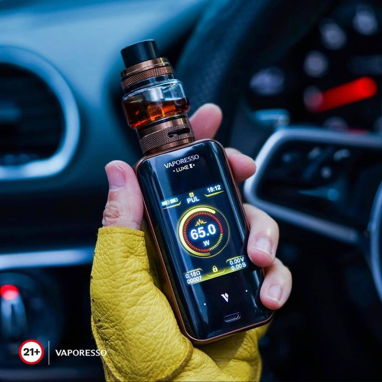 Close-up of Vaporesso Luxe 2 Starter Kit - 220W Dual Battery Vape in hand, displaying digital wattage screen and premium tank setup.