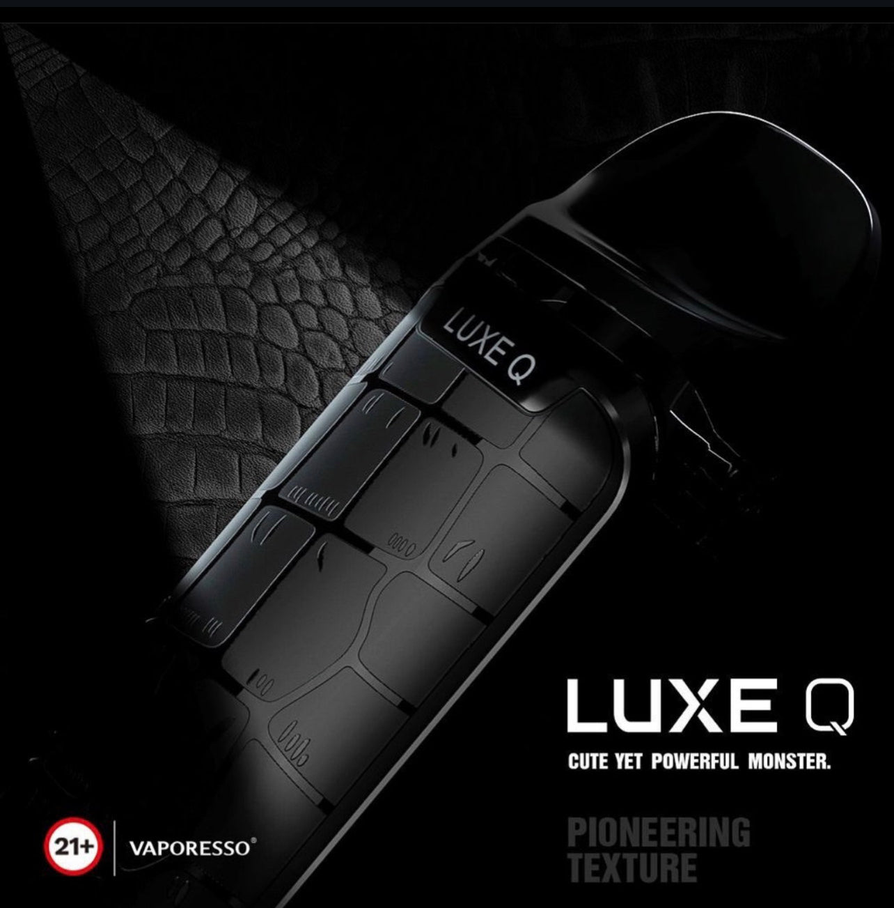 Close-up of black Vaporesso Luxe Q Pod System with crocodile-textured finish, emphasizing powerful compact design and premium aesthetics.