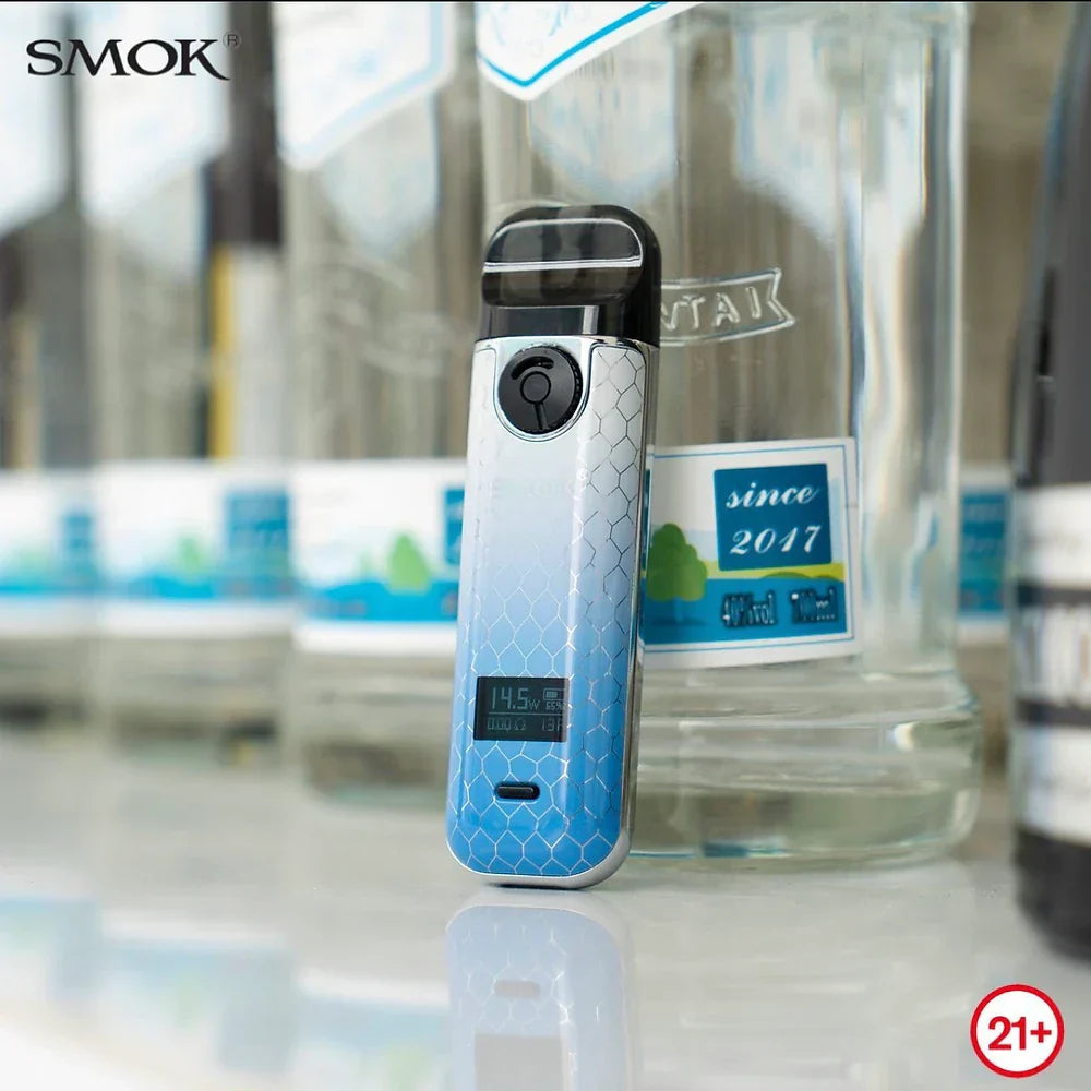 SMOK NOVO 4 Pod Kit - 25W in blue gradient finish displayed upright with OLED screen on, placed against clear bottles for a sleek look.