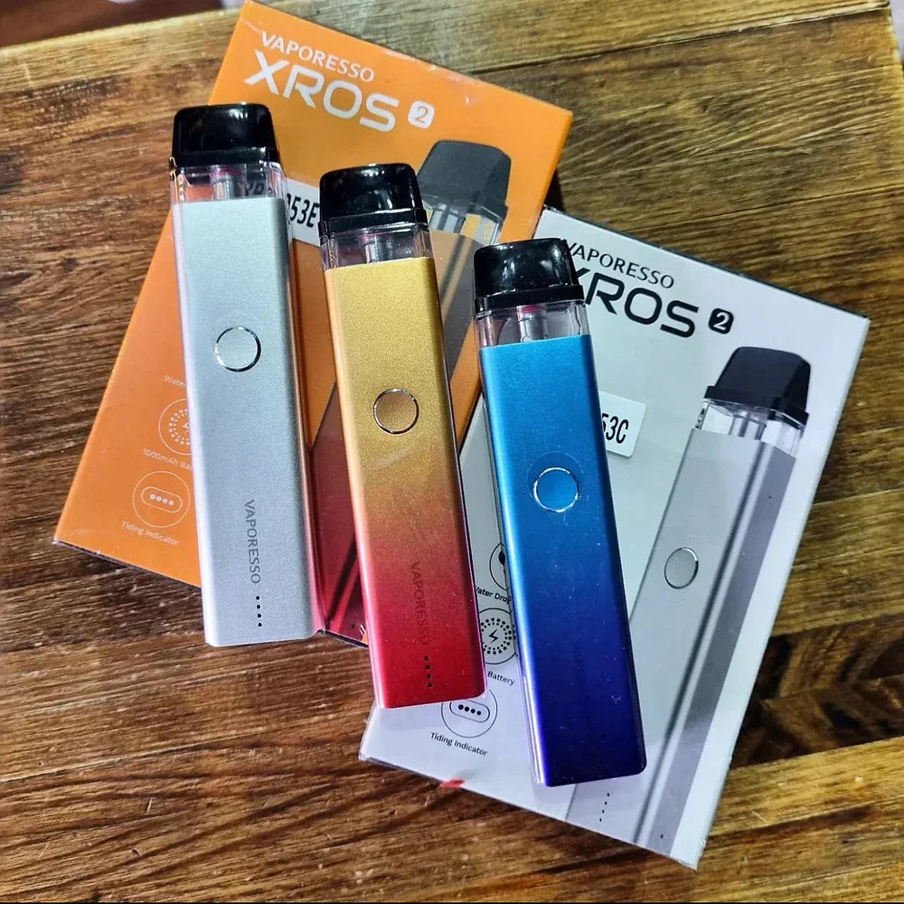 Three Vaporesso XROS 2 Pod Systems with retail packaging, featuring color options and branding for e-commerce display.