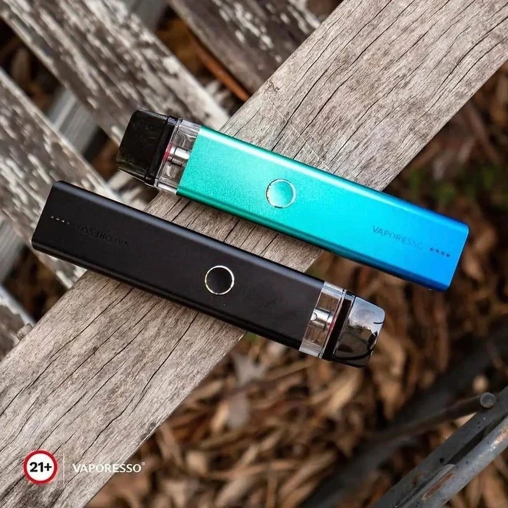 Black and blue Vaporesso XROS 2 Pod Systems placed on wooden surface, highlighting dual firing modes and modern design.
