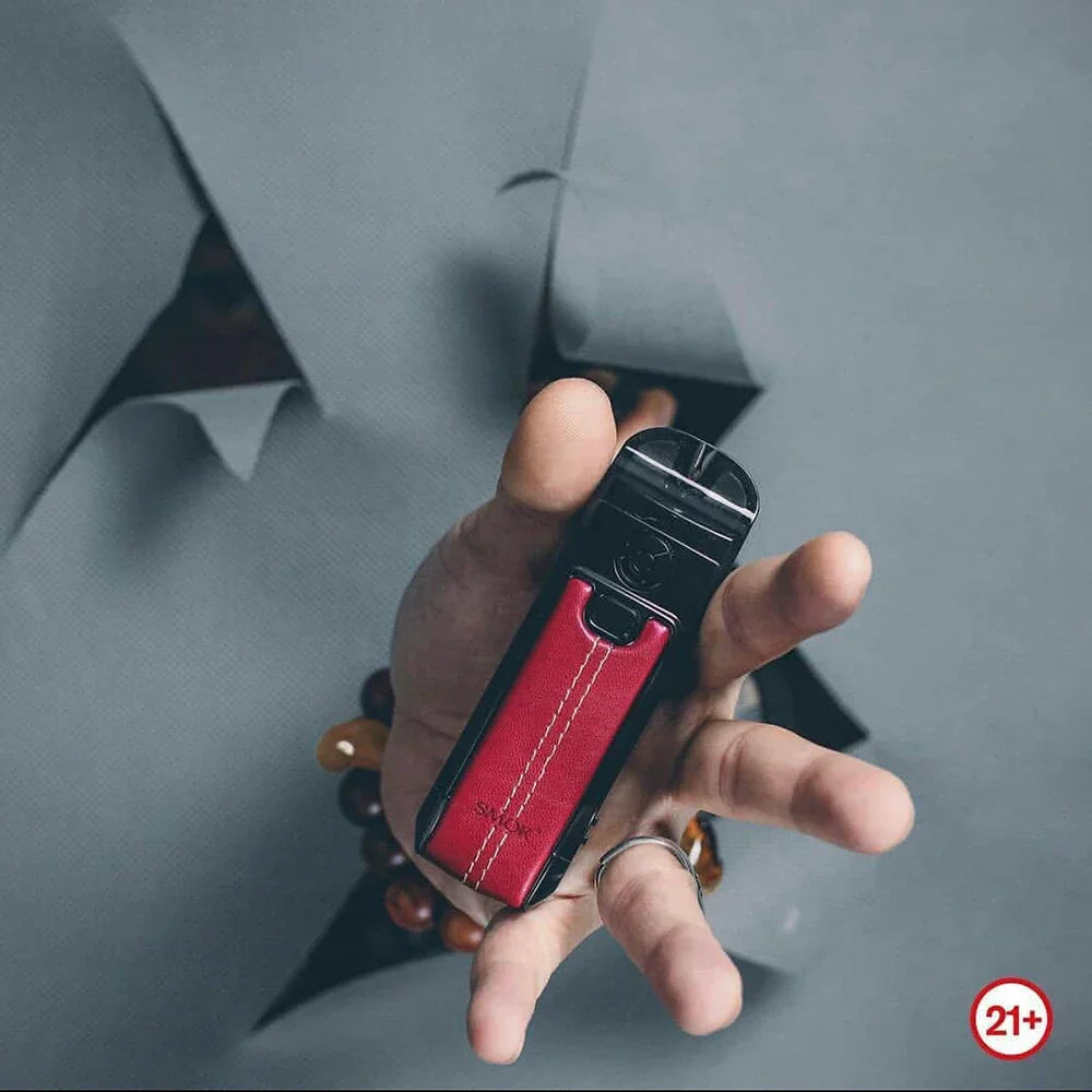 SMOK Nord 4 80W Pod Kit in red leather held in hand, highlighting compact design, dual airflow, and 2000mAh battery for rich vapor experience.