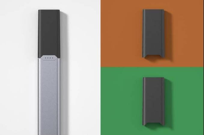 Close-up of Juul 2 device with Virginia Tobacco and Crisp Menthol pods. 18mg nicotine strength for cigarette-like satisfaction in the UK.
