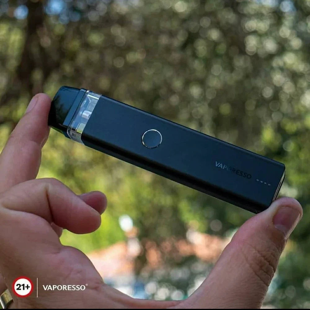 Black Vaporesso XROS 2 Pod System 16W held in hand outdoors, emphasizing ergonomic grip and pocket-friendly size for on-the-go use.