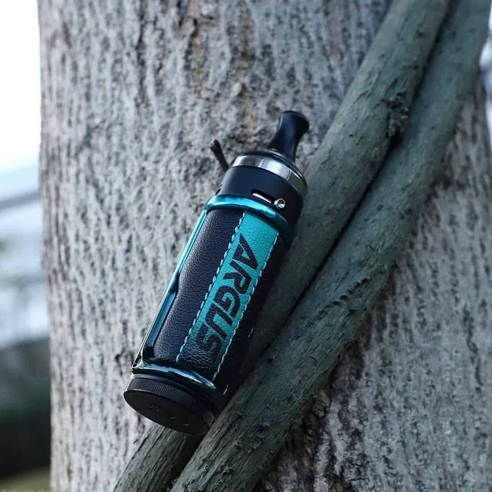 VOOPOO ARGUS 40W Pod Mod Kit in turquoise resting on a tree, showcasing its rugged build and outdoor-friendly durability.