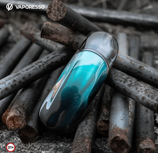 Vaporesso ZERO 2 Pod Kit - Stylish Pod System in teal color resting on rusty metal rods, highlighting its sleek and durable design.