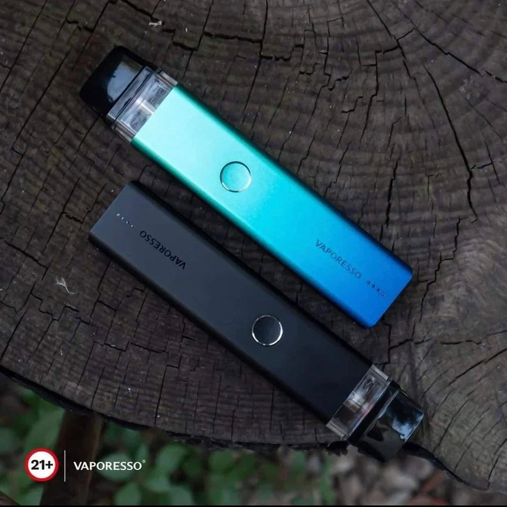 Vaporesso XROS 2 Pod System 16W in black and blue on tree stump, highlighting dual color options and minimalist button design.