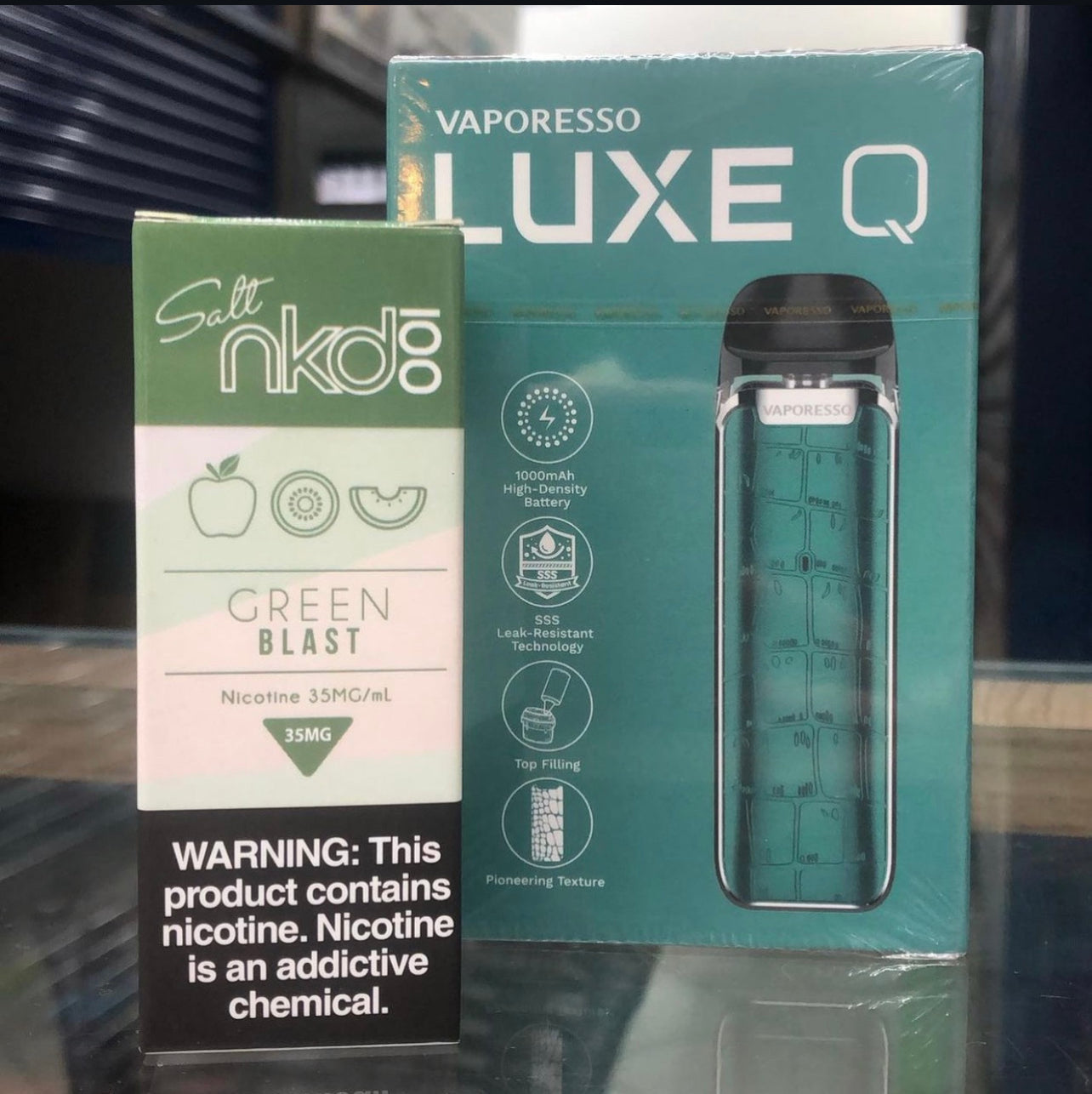 Vaporesso Luxe Q Pod System in green with NKD 100 Green Blast eJuice, highlighting compatibility with nicotine salts and 1000mAh battery.