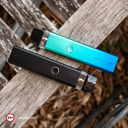 Black and blue Vaporesso XROS 2 Pod Systems placed on wooden surface, highlighting dual firing modes and modern design.