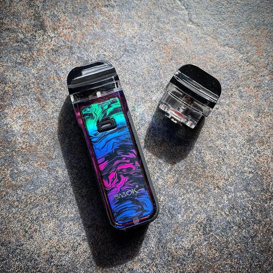 SMOK NORD X Pod System in vibrant swirl design with detachable 6mL pod, showcasing compact build and IP67 durability on stone surface.