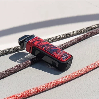 SMOK NORD X 60W Pod System in red-black design resting on boat deck, highlighting rugged IP67 water-resistant build.