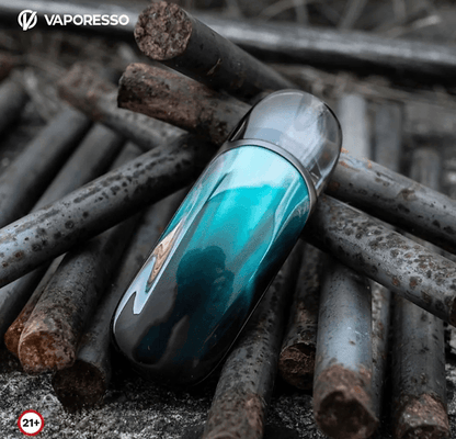Vaporesso ZERO 2 Pod Kit - Stylish Pod System in teal color resting on rusty metal rods, highlighting its sleek and durable design.