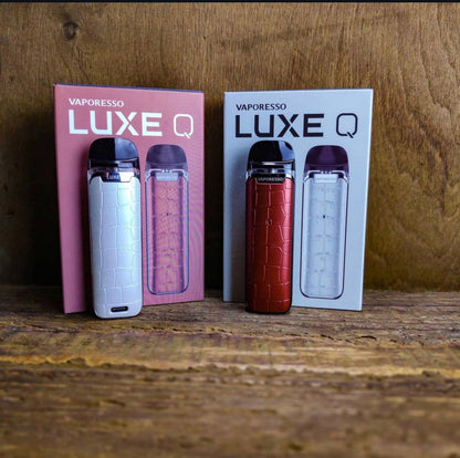 Vaporesso Luxe Q Pod Systems in white and red with matching boxes, featuring 2mL capacity and stylish anti-slip texture for portable vaping.