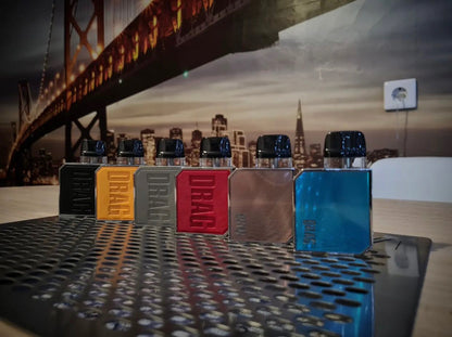 Lineup of VOOPOO Drag Nano 2 Pod Systems in assorted colors on a table, emphasizing stylish options in compact vaping devices.